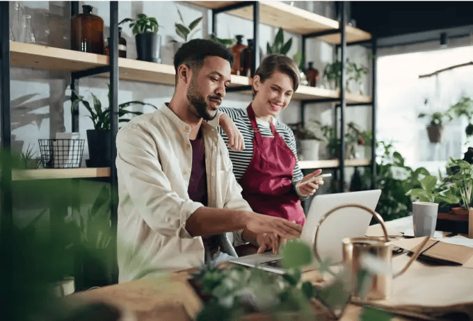 Homeware store staff on laptop